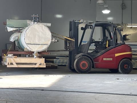 Tank moved by forklift inside a plant